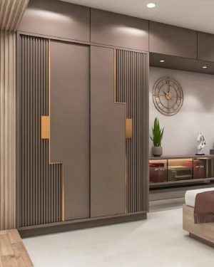 Sliding Door Wardrobe with Textured Panels & Gold Accents