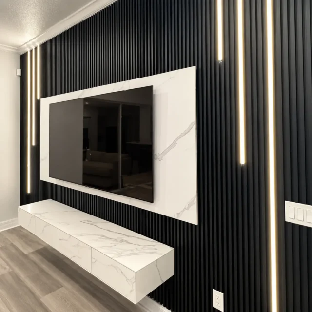 Asymmetric Black & White Media Wall — MJ collection design reference